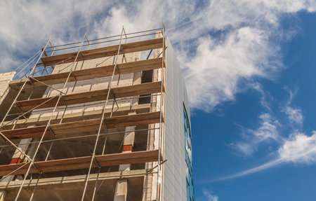 Construction of the new building is completely made of glassの写真素材