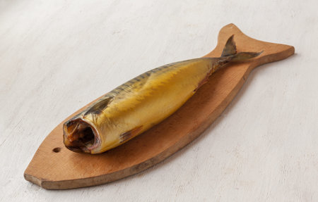 Mackerel smoked chopped to pieces on a cutting board  on the kitchen table