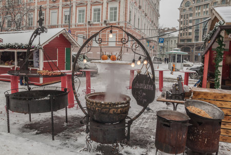 KIEV, UKRAINE-Jan 7, 2017: Hot mulled wine and snacks in the Christmas festivities on St. Sophia and St. Michael's Square in Kiev, Ukraine.のeditorial素材