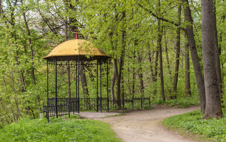 UKRAINE, BELAYA TSERKOV - APRIL 18, 2016: Gazebo near the trails in the arboretum Alexandria, in Belaya Tserkov, Ukraineのeditorial素材
