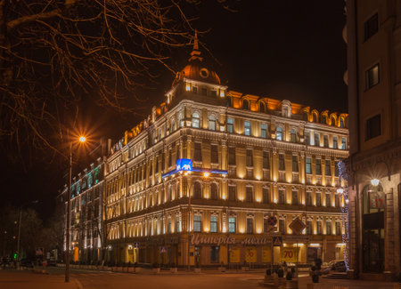 KIEV, UKRAINE - MARCH, 23, 2017: Night multi-colored illumination of the old beautiful buildings of the Ilyinska street on Podol in Kiev, Ukraine, Kiev, Ukraineのeditorial素材