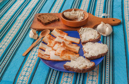 "Pomazuha" traditional bread spread made of lard and garlic consumed of rye bread in Ukraine. Typical ukrainian meal.の写真素材