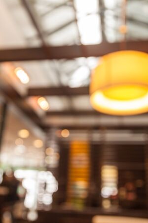 Abstract blur and bokeh coffee shop and restaurant interior for backgroundの写真素材