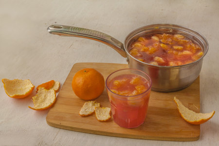 Bucket with brewed orange drink on the kitchen table