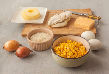 Ingredients for corn salad with pineapple on the kitchen table.の写真素材