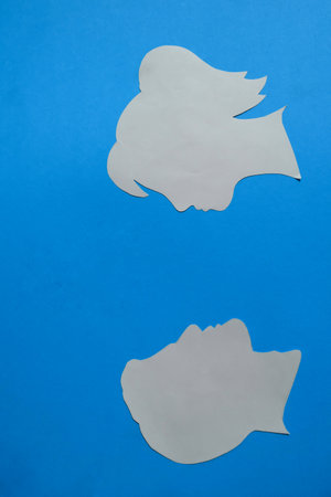 The arrangement symbolizes communication, connection, relationship, or interaction between two individuals.の写真素材