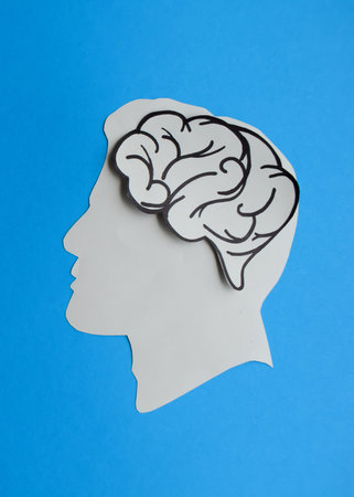 Human Head with Brain on Blue Backgroundの写真素材