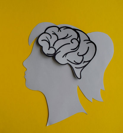 Human Head with Brain on yellow Backgroundの写真素材