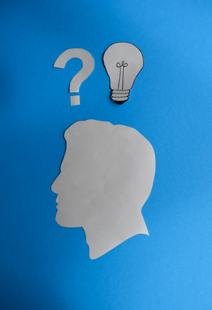 Human Head with Question Mark and Idea Light Bulbの写真素材