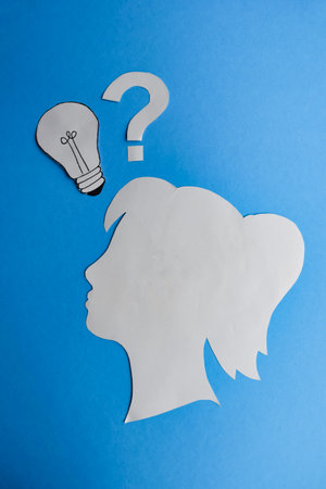 Female Head with Idea Light Bulb and Question Markの写真素材