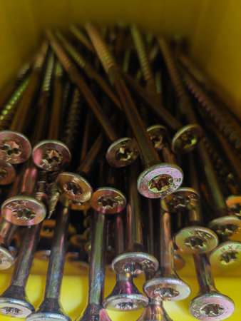 Golden Self-Tapping Screws in a Yellow Box