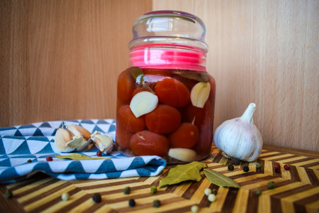 Jar of Pickled Tomatoes with Garlic and Spicesの写真素材