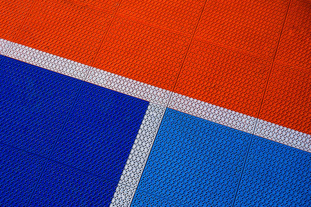 Red and blue painted tennis court floor pattern. Abstract background and texture for design.の写真素材