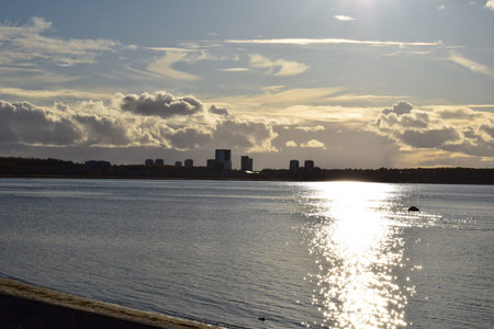 View of the city from the pier on the river at sunset.の写真素材