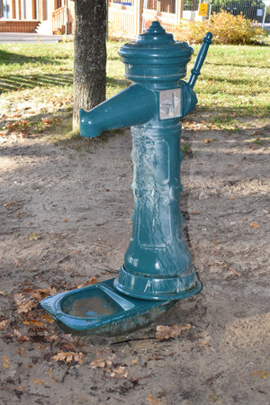 Old blue water pump in the park.の写真素材