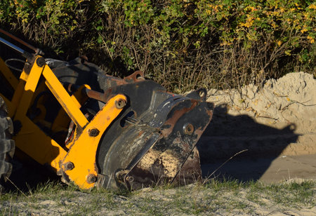 excavator working on a construction site, closeup of photo
