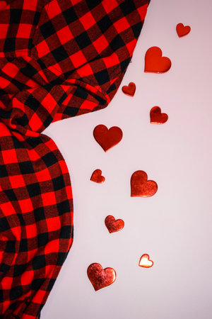 Valentines day background with red hearts and checkered fabricの写真素材