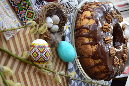 Easter cake with chocolate and nutsrated with eggs and willow branches