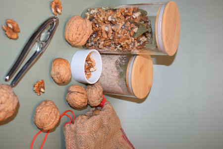 Walnuts in a glass jar and a bag of walnuts.