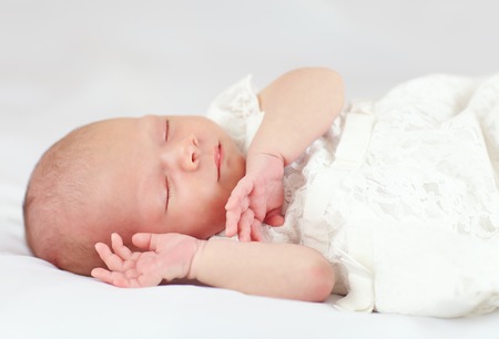 beautiful baby girl sleeping, three weeks oldの写真素材