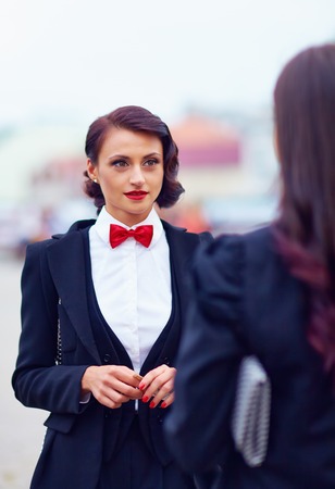beautiful woman in black suitの写真素材