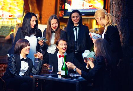 elegant fashionable women gambling in night clubの写真素材