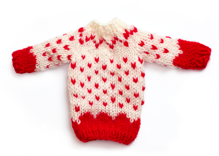 knitted christmas sweater in white and red color, isolated on whiteの写真素材