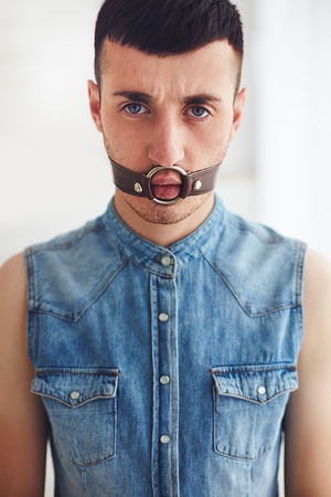 portrait of young man with face bondageの写真素材
