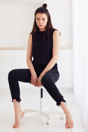 young female posing on model test photo shoot with natural day lightの写真素材