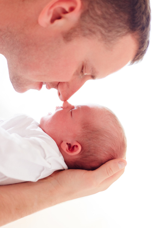 portrait of young father with newborn baby daughterの写真素材