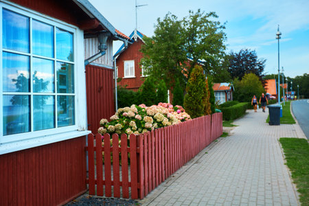 JUODKRANTE, LITHUANIA - August 18, 2019: Beautiful street with old Lithuanian traditional wooden...