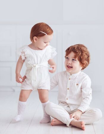adorable redhead siblings smilling, having fun togetherの写真素材