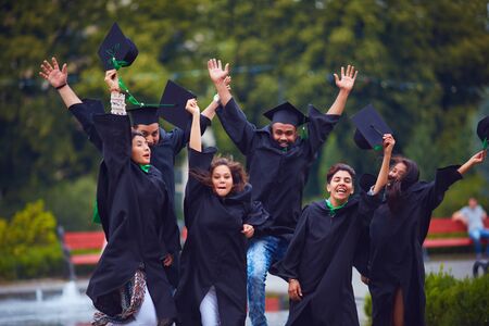 group of happy indian students celebrating the college graduation, passing the final university examの写真素材