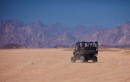 riding a buggy car through the desert. thrill tourism adventuresの写真素材