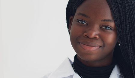 headshot portrait of young beautiful african american woman, smiling face