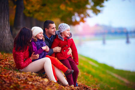 portrait of happy family in autumn parkの写真素材