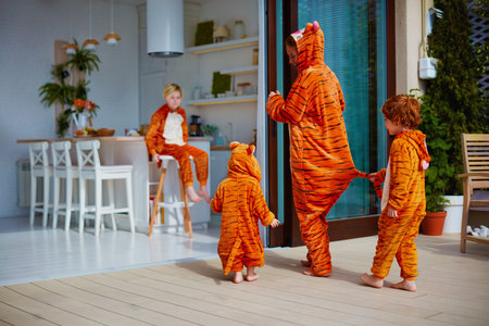 home activity on quarantine, family arranging a costume home partyの写真素材