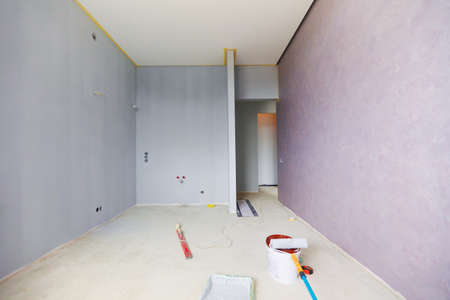 a new apartment repair finishing works in progress, plastering, painting and flooring constructionの写真素材