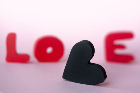 Love text on pink background. Mother's, Women's, Wedding, Happy st Valentines Day concept, 14th February. Top View, copy space.の写真素材