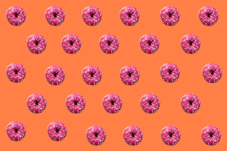 Delicious donuts on color backgroundの写真素材