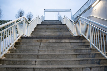 Steps to a bridge over a highway or an exit from a subway or train station in a big city, deserted...