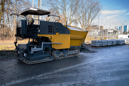 Asphalt paver on a construction site, ready for workの写真素材