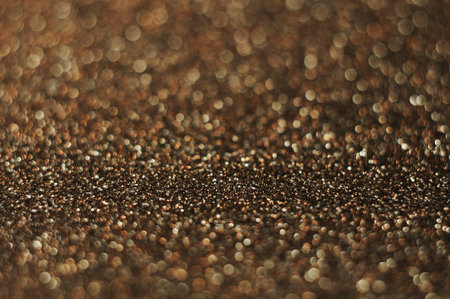 Dark golden and brown brilliant vintage lights background. de-focused