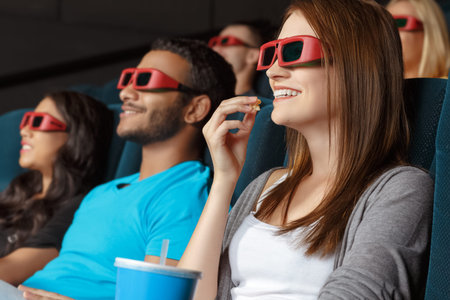 Friends watching 3D movie in the cinema