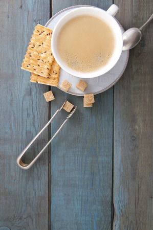 Cup of coffee and sugar on old wooden boards.
Studio photography.の写真素材