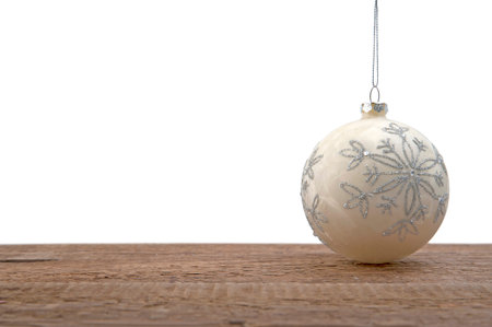 Christmas-tree toy on a wooden table.Studio photography on a white background. Isolated.の写真素材