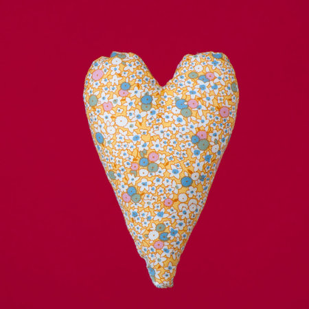 Tissue heart on a red background.Studio photography on a red background.
