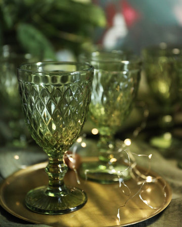 Green glasses on the table with a green cotton tableclothの写真素材