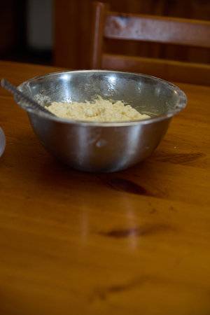 Pancake Batter: Metal Bowl on Wooden Table Surface
