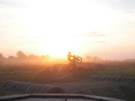 Man on enduro moto in sunset. Off roadの写真素材